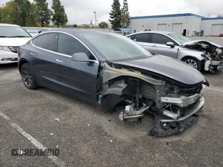 2019 Tesla Model 3 Mid Range with VIN 5YJ3E1EA9KF447453, listed as a Copart auction lot 48967605 with 72,031 mi miles and Salvage Title. Bid and sale history available at DreamBid. Image 4.
