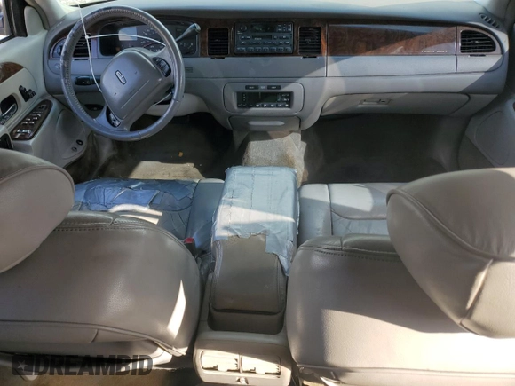 1999 Lincoln Town Car Executive z VIN 1LNHM81W4XY714116, wystawiony jako Copart lot #44424595 z przebiegiem 210 041 mil mil oraz Szkoda całkowita • Salvage title. Historia ofert i sprzedaży dostępna na DreamBid. Obrazek 8.