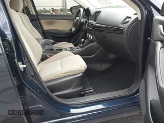 2016 Mazda CX-5 Sport with VIN JM3KE2BY0G0850298, listed as a IAAI auction lot 42107007 with 97,478 mi miles. Bid and sale history available at carsss.com. Image 5.