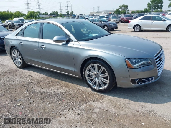 2013 Audi A8 4.0L with VIN WAUA2AFD5DN021950, listed as a IAAI auction lot 42472512 with 126,964 mi miles and . Bid and sale history available at DreamBid. Image 1.