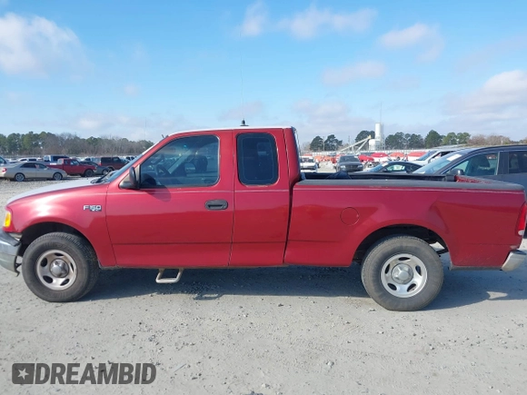 2000 Ford F-150 XL with VIN 1FTZX1729YNC32076, listed as a IAAI auction lot 41523364 with 216,726 mi miles. Bid and sale history available at carsss.com. Image 14.