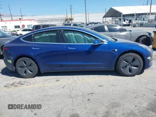 2020 Tesla Model 3 Standard Range Plus with VIN 5YJ3E1EA1LF590396, listed as a IAAI auction lot 41868089 with 51,278 mi miles. Bid and sale history available at carsss.com. Image 13.