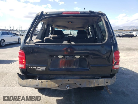 2003 Ford Explorer Sport XLS z VIN 1FMYU60E93UC12832, wystawiony jako Copart lot #71596394 z przebiegiem 197 215 mil mil oraz Szkody całkowita. Historia ofert i sprzedaży dostępna na DreamBid. Obrazek 6.