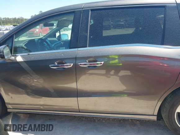 2020 Honda Odyssey Touring with VIN 5FNRL6H87LB002202, listed as a IAAI auction lot 42015741 with 182,051 mi miles and . Bid and sale history available at DreamBid. Image 14.