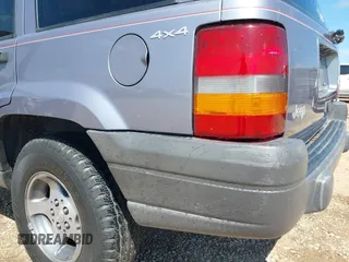 1996 Jeep Grand Cherokee with VIN 1J4EZ58S5TC149533, listed as a IAAI auction lot 42456529 with 173,872 mi miles and . Bid and sale history available at DreamBid. Image 6.