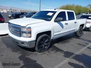 2014 Chevrolet Silverado 1500 LT with VIN 3GCUKRECXEG548397, listed as a IAAI auction lot 41746858 with 215,490 mi miles. Bid and sale history available at carsss.com. Image 2.