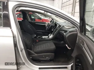2016 Ford Fusion SE Hybrid z VIN 3FA6P0LU1GR304166, wystawiony jako IAAI lot #41932720 z przebiegiem 68 058 mil mil oraz . Historia ofert i sprzedaży dostępna na DreamBid. Obrazek 5.