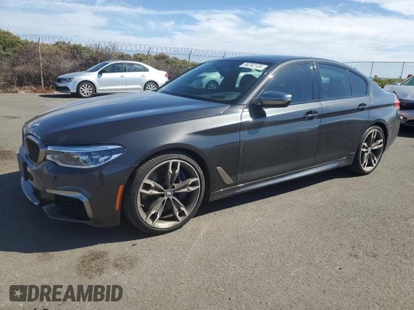 2019 BMW 5 Series M550i xDrive with VIN WBAJB9C57KB289036, listed as a Copart auction lot 86292134 with 28,103 mi miles and Salvage title. Bid and sale history available at DreamBid. Image 1.