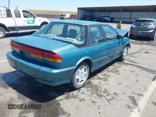1995 Saturn SL with VIN 1G8ZK5275SZ303745, listed as a IAAI auction lot 42280801 with 137,719 mi miles and . Bid and sale history available at DreamBid. Image 4.