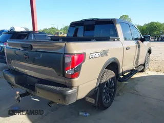 2021 Nissan Titan SV with VIN 1N6AA1ED1MN523973, listed as a IAAI auction lot 42406382 with 73,688 mi miles and . Bid and sale history available at DreamBid. Image 4.