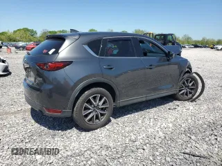 2018 Mazda CX-5 Grand Touring z VIN JM3KFBDM3J0351106, wystawiony jako Copart lot #52553925 z przebiegiem Nie podano mil oraz Szkoda całkowita • Salvage title. Historia ofert i sprzedaży dostępna na DreamBid. Obrazek 3.