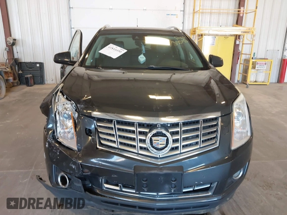 2014 Cadillac SRX Premium Collection z VIN 3GYFNGE38ES606731, wystawiony jako IAAI lot #41844450 z przebiegiem 156 541 mil mil oraz . Historia ofert i sprzedaży dostępna na DreamBid. Obrazek 12.
