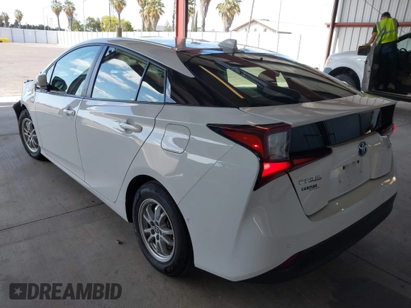 2021 Toyota Prius L Eco z VIN JTDKAMFU5M3146342, wystawiony jako IAAI lot #42249219 z przebiegiem 49 810 mil mil oraz . Historia ofert i sprzedaży dostępna na DreamBid. Obrazek 3.