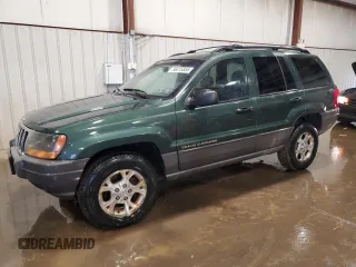 2000 Jeep Grand Cherokee Laredo z VIN 1J4GW48S2YC256123, wystawiony jako Copart lot #56015855 z przebiegiem 147 549 mil mil oraz Szkody całkowita. Historia ofert i sprzedaży dostępna na DreamBid. Obrazek 1.