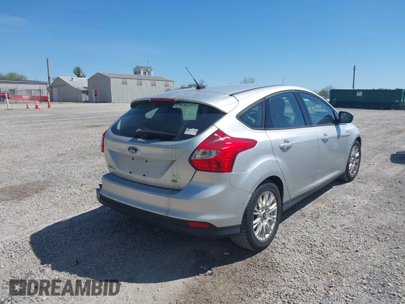 2012 Ford Focus SE with VIN 1FAHP3K27CL333433, listed as a IAAI auction lot 42140452 with 156,048 mi miles and . Bid and sale history available at carsss.com. Image 4.