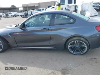 2018 BMW M2 with VIN WBS1J5C50JVE51869, listed as a IAAI auction lot 41814404 with 69,684 mi miles. Bid and sale history available at carsss.com. Image 14.
