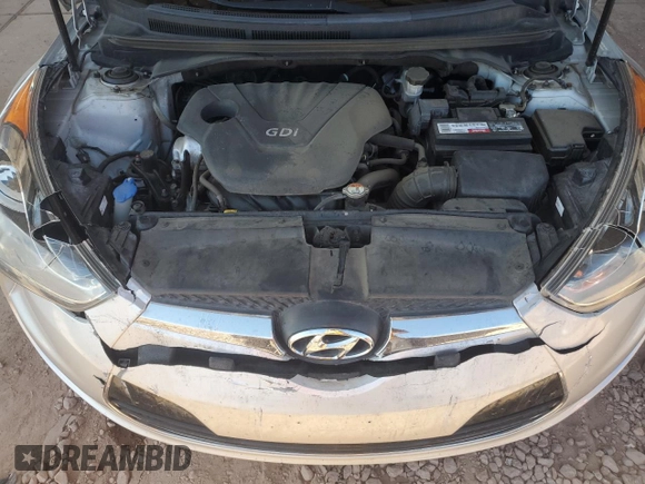 2014 Hyundai Veloster z VIN KMHTC6AD7EU216819, wystawiony jako Copart lot #57135335 z przebiegiem 104 588 mil mil oraz Szkoda całkowita • Salvage title. Historia ofert i sprzedaży dostępna na DreamBid. Obrazek 11.