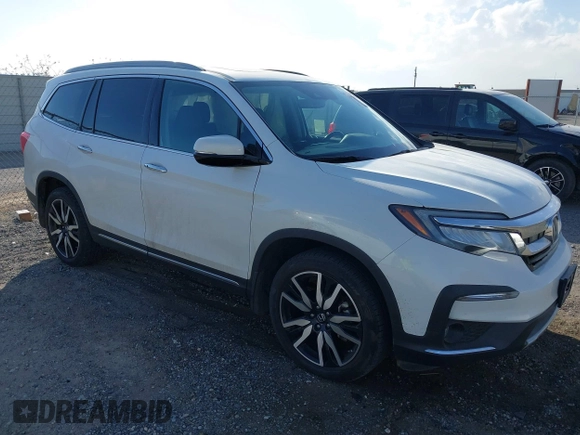 2022 Honda Pilot Touring 7-Passenger with VIN 5FNYF6H67NB017660, listed as a IAAI auction lot 41194603 with 87,301 mi miles. Bid and sale history available at carsss.com. Image 1.