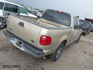 2001 Ford F-150 SuperCrew XLT with VIN 1FTRW07W61KE35305, listed as a IAAI auction lot 41912087 with 221,826 mi miles. Bid and sale history available at carsss.com. Image 4.