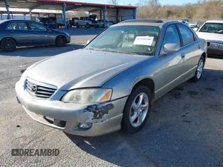 2002 Mazda Millenia z VIN JM1TA221021739118, wystawiony jako IAAI lot #41268546 z przebiegiem 182 463 mil mil oraz . Historia ofert i sprzedaży dostępna na DreamBid. Obrazek 2.