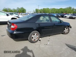 2002 Toyota Camry XLE z VIN 4T1BF32K02U034535, wystawiony jako Copart lot #53894995 z przebiegiem 253 037 mil mil oraz Szkoda całkowita • Salvage title. Historia ofert i sprzedaży dostępna na DreamBid. Obrazek 3.
