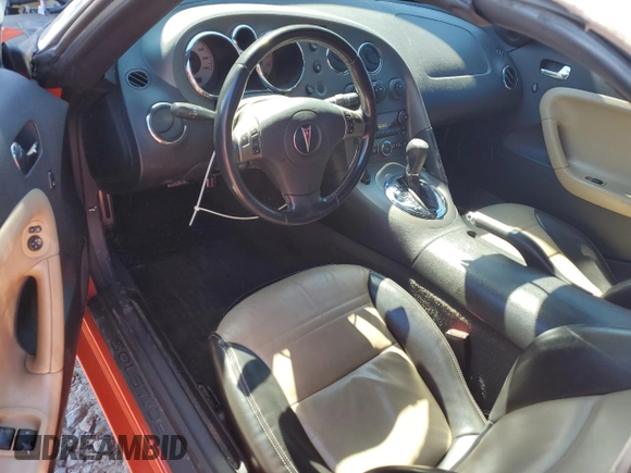 2008 Pontiac Solstice z VIN 1G2MC35BX8Y116246, wystawiony jako Copart lot #46834035 z przebiegiem 70 608 mil mil oraz Szkody całkowita. Historia ofert i sprzedaży dostępna na DreamBid. Obrazek 8.