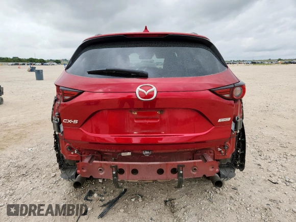 2018 Mazda CX-5 Grand Touring with VIN JM3KFADM8J0451535, listed as a Copart auction lot 59990435 with 77,163 mi miles and Salvage title. Bid and sale history available at DreamBid. Image 6.
