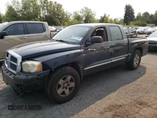 2005 Dodge Dakota Laramie with VIN 1D7HW58N65S161629, listed as a Copart auction lot 66570164 with 205,984 mi miles and Salvage Title. Bid and sale history available at carsss.com. Image 1.