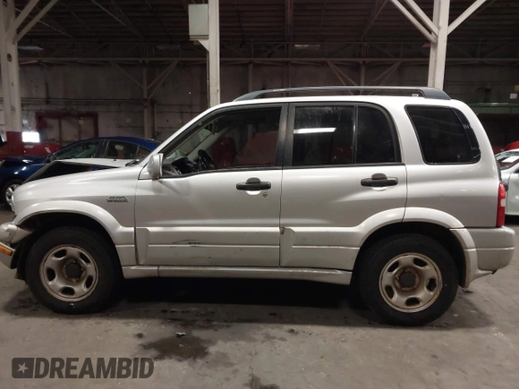 2002 Suzuki Grand Vitara JLX z VIN JS3TD62V324161291, wystawiony jako IAAI lot #41577344 z przebiegiem 164 658 mil mil oraz . Historia ofert i sprzedaży dostępna na DreamBid. Obrazek 14.