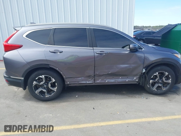 2018 Honda CR-V Touring with VIN 7FARW1H9XJE018575, listed as a IAAI auction lot 41747192 with 83,699 mi miles and . Bid and sale history available at carsss.com. Image 13.