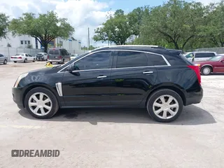 2015 Cadillac SRX Performance Collection z VIN 3GYFNCE31FS597798, wystawiony jako IAAI lot #42387793 z przebiegiem 159 986 mil mil oraz . Historia ofert i sprzedaży dostępna na DreamBid. Obrazek 14.