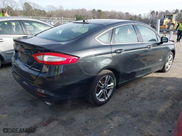 2015 Ford Fusion Energi Titanium with VIN 3FA6P0SU8FR189159, listed as a IAAI auction lot 41595744 with 170,558 mi miles. Bid and sale history available at carsss.com. Image 4.