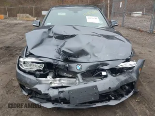 2018 BMW 3 Series with VIN WBA8F1C54JAE93207, listed as a IAAI auction lot 41876781 with 64,749 mi miles and . Bid and sale history available at DreamBid. Image 12.