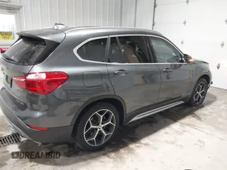 2018 BMW X1 xDrive28i with VIN WBXHT3C38J5L34625, listed as a IAAI auction lot 41133876 with 60,986 mi miles and . Bid and sale history available at DreamBid. Image 4.