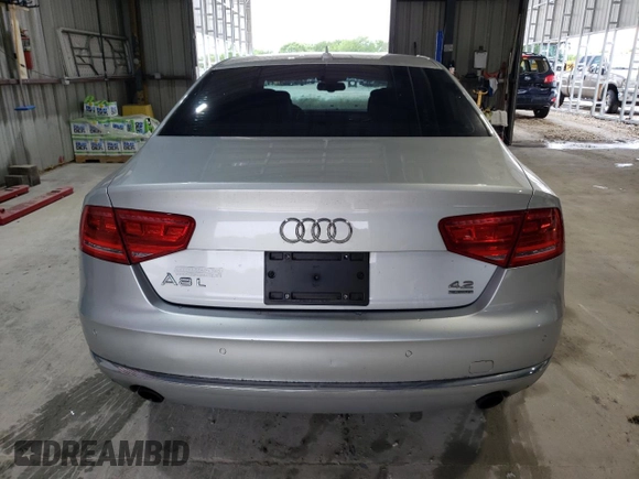 2012 Audi A8 z VIN WAURVAFD4CN038599, wystawiony jako Copart lot #59554025 z przebiegiem 93 334 mil mil oraz Szkoda całkowita • Salvage title. Historia ofert i sprzedaży dostępna na DreamBid. Obrazek 6.