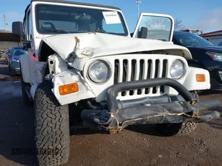 2002 Jeep Wrangler Sahara with VIN 1J4FA59S62P772256, listed as a IAAI auction lot 41968844 with 170,218 mi miles. Bid and sale history available at carsss.com. Image 6.