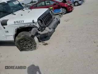 2016 Jeep Wrangler Willys Wheeler z VIN 1C4AJWAG7GL297695, wystawiony jako Copart lot #70838414 z przebiegiem 82 813 mil mil oraz Szkoda całkowita • Salvage title. Historia ofert i sprzedaży dostępna na DreamBid. Obrazek 11.