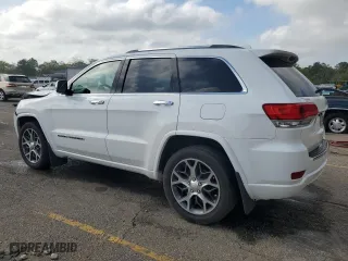 2019 Jeep Grand Cherokee Overland with VIN 1C4RJECG4KC833019, listed as a Copart auction lot 51277555 with 124,072 mi miles and Salvage Title. Bid and sale history available at carsss.com. Image 2.