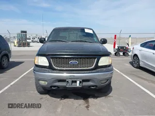 2003 Ford F-150 XLT with VIN 1FTRW08L83KA14760, listed as a IAAI auction lot 41820943 with 215,130 mi miles. Bid and sale history available at carsss.com. Image 12.