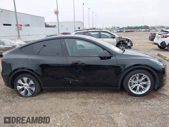 2023 Tesla Model Y Long Range z VIN 7SAYGDEEXPA181114, wystawiony jako IAAI lot #41564617 z przebiegiem 64 990 mil mil oraz . Historia ofert i sprzedaży dostępna na DreamBid. Obrazek 14.