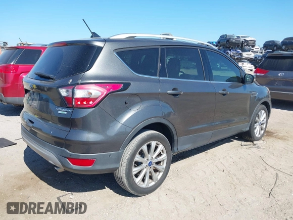 2018 Ford Escape Titanium with VIN 1FMCU0J99JUB09562, listed as a IAAI auction lot 41547659 with 63,700 mi miles and . Bid and sale history available at DreamBid. Image 4.
