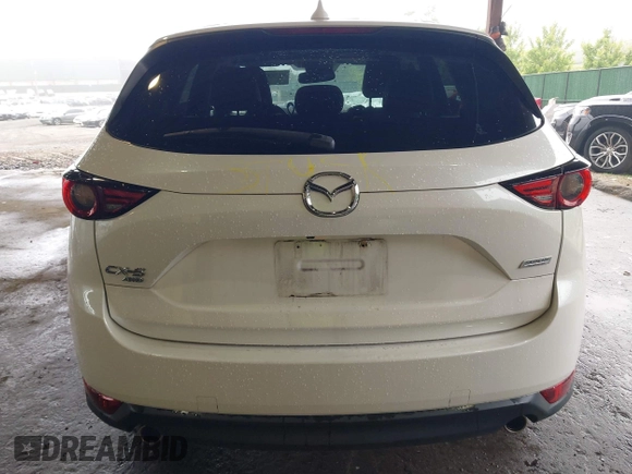 2019 Mazda CX-5 Grand Touring with VIN JM3KFBDMXK0648813, listed as a IAAI auction lot 42524680 with 23,521 mi miles and . Bid and sale history available at DreamBid. Image 17.