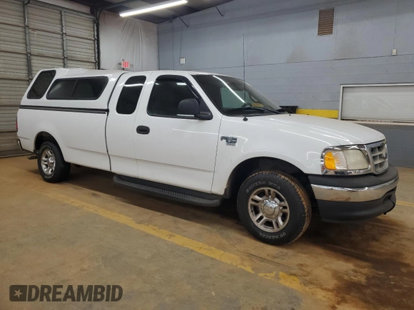 2001 Ford F-150 XL with VIN 1FTRX17L51NB25752, listed as a Copart auction lot 48721235 with 179,941 mi miles and Salvage title. Bid and sale history available at DreamBid. Image 4.