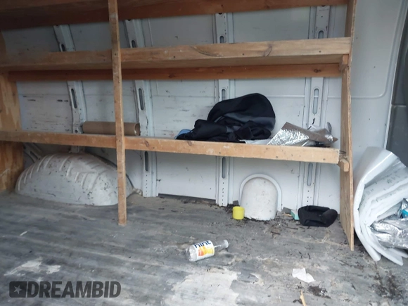 2012 Chevrolet Express Cargo with VIN 1GCWGFFA8C1108597, listed as a IAAI auction lot 42323808 with 200,965 mi miles and . Bid and sale history available at DreamBid. Image 8.