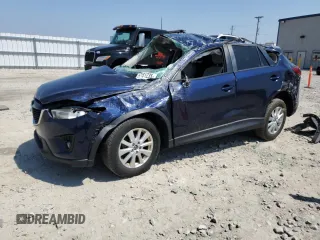 2014 Mazda CX-5 Touring z VIN JM3KE4CY9E0330110, wystawiony jako Copart lot #57151235 z przebiegiem 160 821 mil mil oraz Nie do naprawy. Historia ofert i sprzedaży dostępna na DreamBid. Obrazek 1.