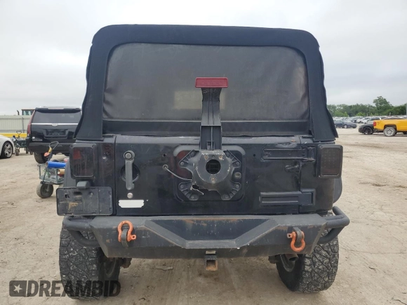 2007 Jeep Wrangler Unlimited Rubicon with VIN 1J4GA69117L112867, listed as a Copart auction lot 59909565 with 166,963 mi miles and Salvage title. Bid and sale history available at DreamBid. Image 6.