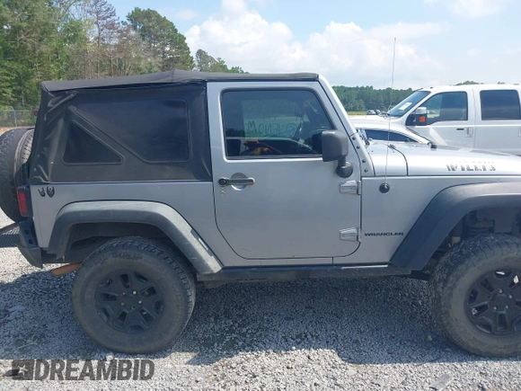2015 Jeep Wrangler Freedom Edition with VIN 1C4AJWAG4FL589769, listed as a IAAI auction lot 42704488 with 194,414 mi miles and . Bid and sale history available at DreamBid. Image 13.