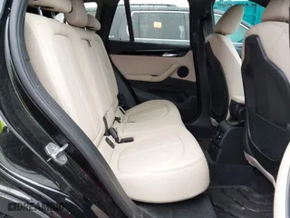 2018 BMW X1 xDrive28i with VIN WBXHT3C39J3H30531, listed as a IAAI auction lot 41890734 with 59,147 mi miles. Bid and sale history available at carsss.com. Image 8.