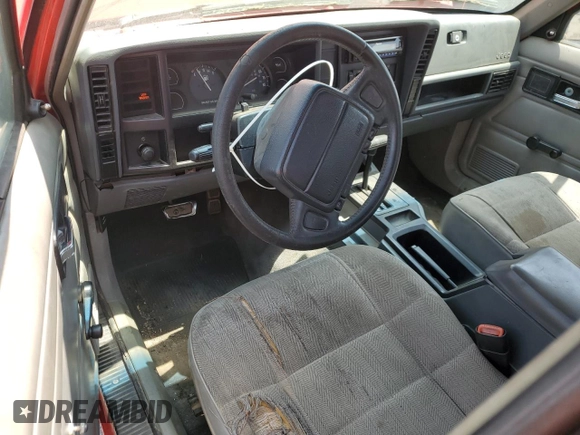 1996 Jeep Cherokee SE with VIN 1J4FT28S3TL213153, listed as a Copart auction lot 57217625 with 331,741 mi miles and Salvage title. Bid and sale history available at DreamBid. Image 8.