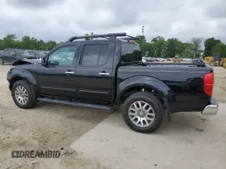 2011 Nissan Frontier Pro-4X with VIN 1N6AD0EVXBC433028, listed as a Copart auction lot 57653305 with 144,753 mi miles and Salvage title. Bid and sale history available at DreamBid. Image 2.